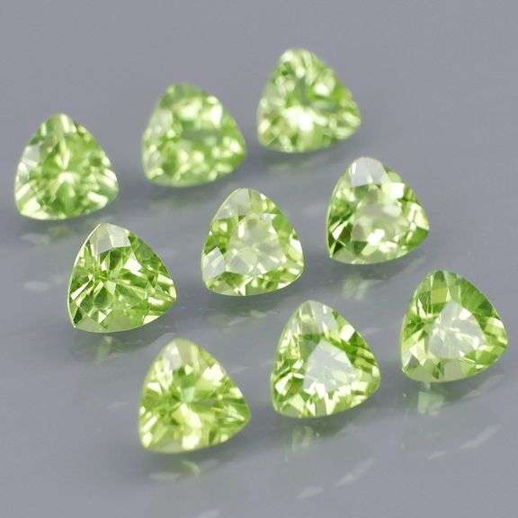 Fantastic 4.32ct 5x5mm trillion cut Peridot set