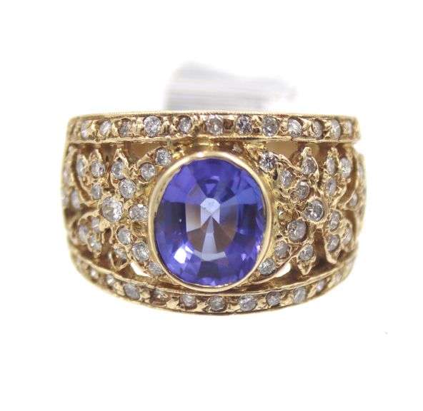 14kt Yellow gold 3.45ct Oval Tanzanite in Intricate Diamond wide setting