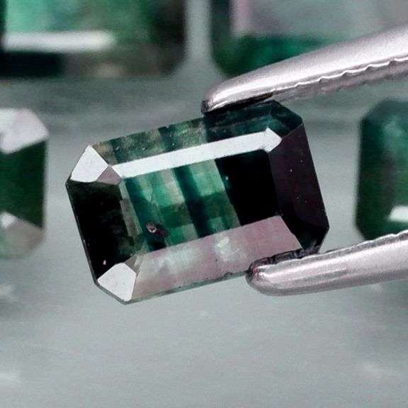 Stunning blue green 5.26ct emerald cut Sapphire set