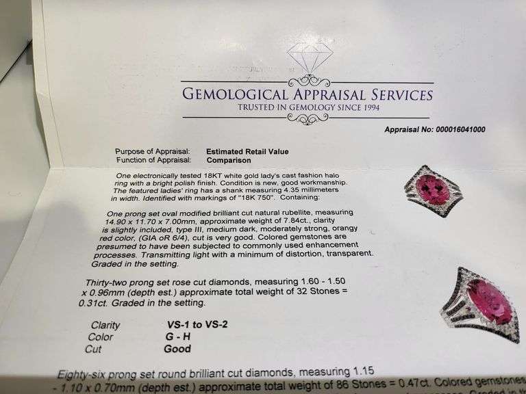 Striking 18K White Gold Halo Fashion Ring with 7.84 ct Oval Ruby and Diamond Accents