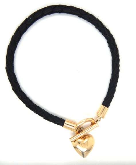 Black cord twisted bracelet with 14kt yellow gold heart shaped charm and toggle clasp