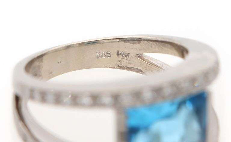 14kt White gold diamond and blue topaz set ring