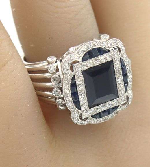 Platinum baguette and princess cut sapphire and single cut diamond halo art deco style ring