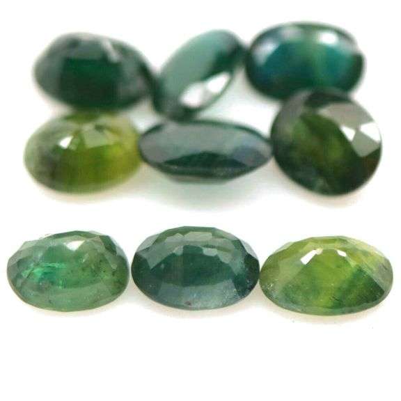 Heated only! 7.75ct blue green Sapphire set