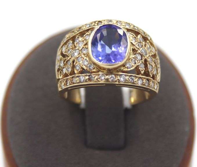 14kt Yellow gold 3.45ct Oval Tanzanite in Intricate Diamond wide setting