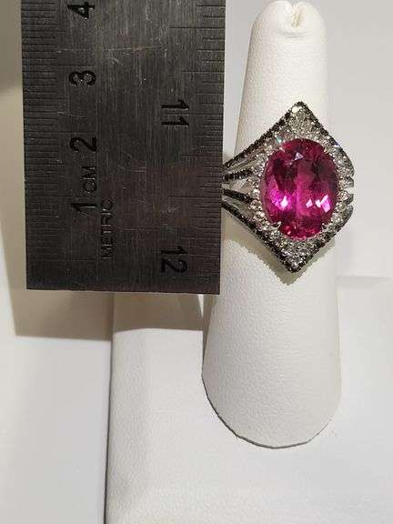Striking 18K White Gold Halo Fashion Ring with 7.84 ct Oval Ruby and Diamond Accents