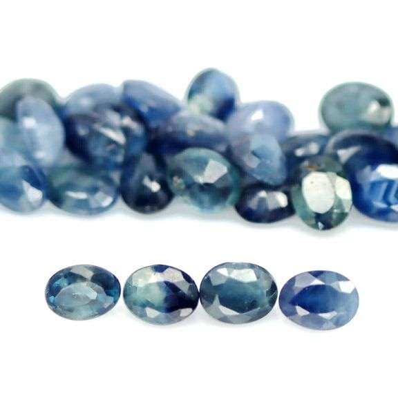 Heated only! 10.15ct blue green Sapphire set