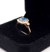 14kt Rose gold blue topaz & diamond Halo Ring