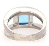 14kt White gold diamond and blue topaz set ring