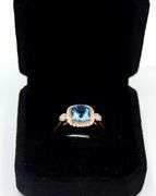 14kt Rose gold blue topaz & diamond Halo Ring