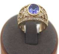 14kt Yellow gold 3.45ct Oval Tanzanite in Intricate Diamond wide setting