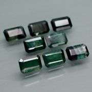 Stunning blue green 5.26ct emerald cut Sapphire set