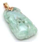 Hand carved green Jade pendant in 14kt yellow gold