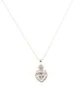 10kt White gold baguette and round diamond heart shaped pendant on chain