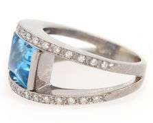 14kt White gold diamond and blue topaz set ring
