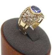 14kt Yellow gold 3.45ct Oval Tanzanite in Intricate Diamond wide setting
