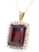 Emerald cut synthetic ruby and CZ halo frame pendant on chain in yellow gold