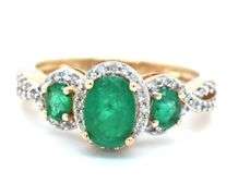 14kt Yellow gold 3 stone oval emerald and diamond halo ring