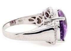 14kt White gold oval amethyst and diamond frame ring