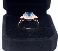 14kt Rose gold blue topaz & diamond Halo Ring