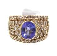 14kt Yellow gold 3.45ct Oval Tanzanite in Intricate Diamond wide setting