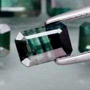 Stunning blue green 5.26ct emerald cut Sapphire set