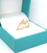 14kt Yellow gold oval opal and diamond halo ring