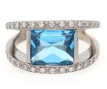 14kt White gold diamond and blue topaz set ring