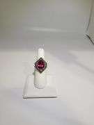 Striking 18K White Gold Halo Fashion Ring with 7.84 ct Oval Ruby and Diamond Accents