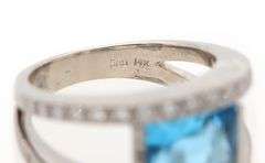 14kt White gold diamond and blue topaz set ring