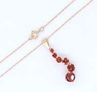 14kt Yellow gold garnet journey pendant on chain necklace