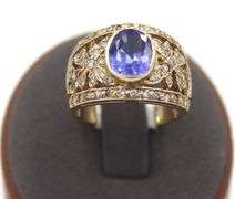 14kt Yellow gold 3.45ct Oval Tanzanite in Intricate Diamond wide setting