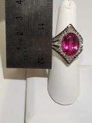 Striking 18K White Gold Halo Fashion Ring with 7.84 ct Oval Ruby and Diamond Accents