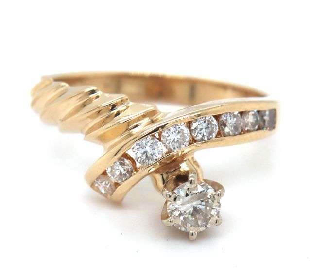 14kt Yellow gold 0.50ctw channel set twisted shank engagement ring