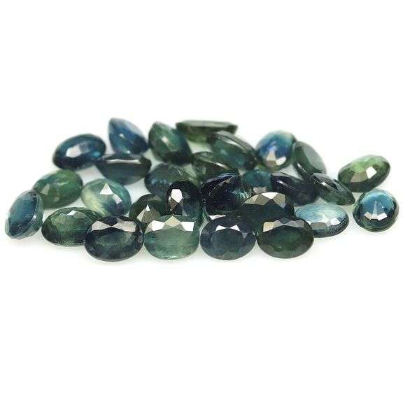 Heated only! 7.90ct blue green Sapphire set