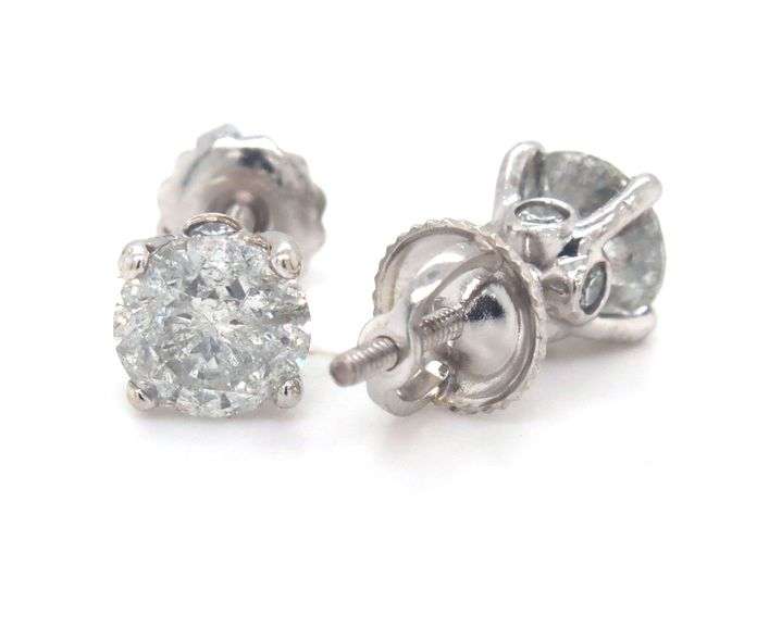 One pair of 14kt white gold round brilliant cut diamond stud earrings