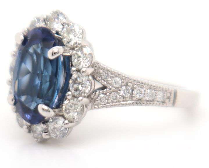 2.71ct Oval Tanzanite and 1.12ctw Diamond Frame Ring in 14K
