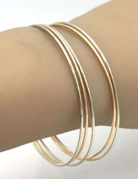 18kt White and yellow gold set of 5 bangles