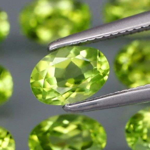 Fantastic 4.99ct 6x4mm oval cut Peridot set