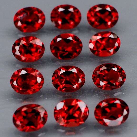 Lovely 5.51ct oval cut cherry red Garnet set