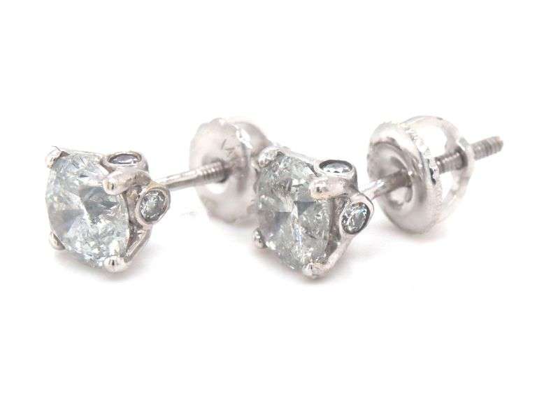 One pair of 14kt white gold round brilliant cut diamond stud earrings
