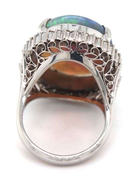 Platinum 10.92ct oval opal and 0.78ctw diamond halo ring