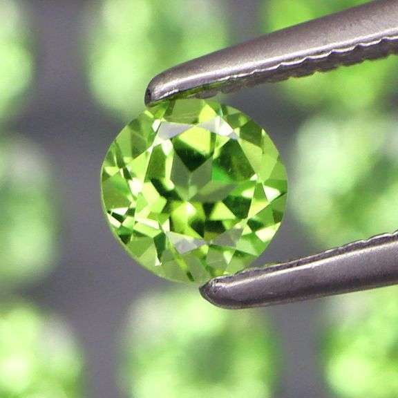 Awesome 4.42ct diamond cut Peridot set
