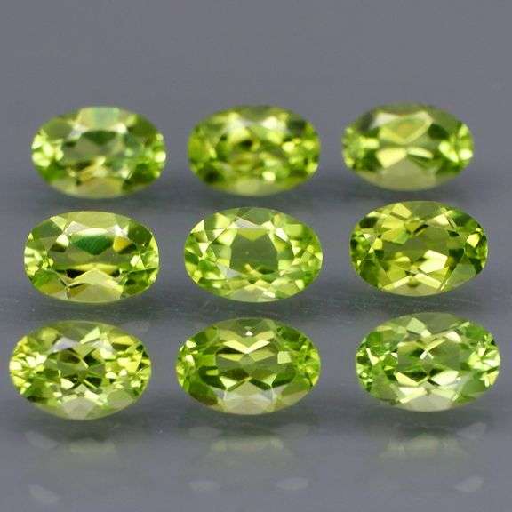Fantastic 4.99ct 6x4mm oval cut Peridot set