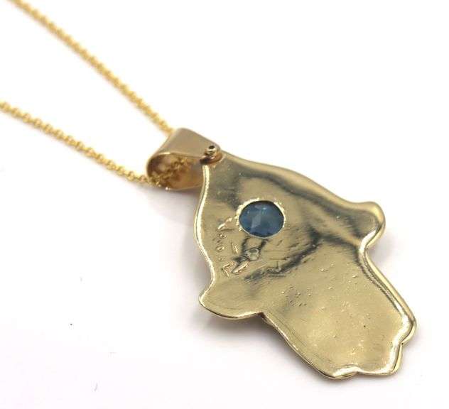 14kt Yellow gold Vintage Hamsa pendant with blue stone