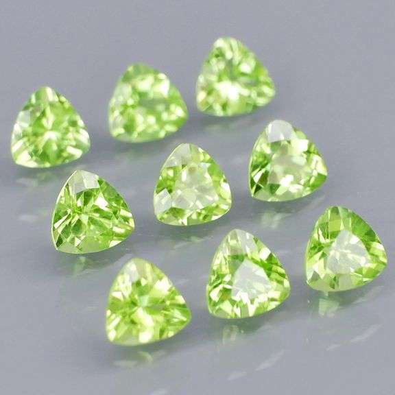 Fantastic 4.45ct 5x5mm trillion cut Peridot set