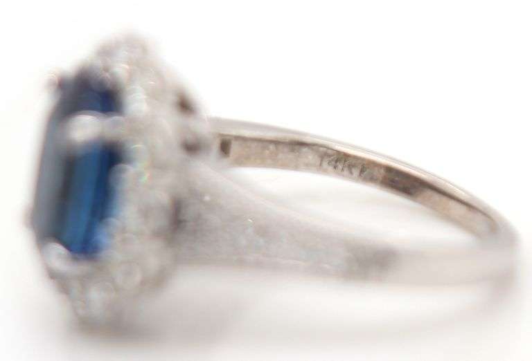 2.71ct Oval Tanzanite and 1.12ctw Diamond Frame Ring in 14K