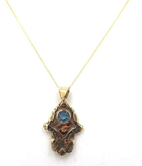 14kt Yellow gold Vintage Hamsa pendant with blue stone