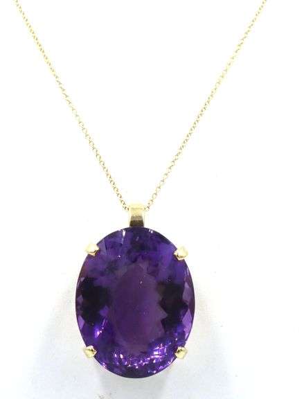 14kt Yellow gold 50ct oval amethyst pendant on chain