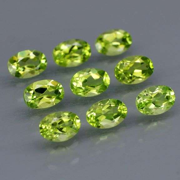 Fantastic 4.99ct 6x4mm oval cut Peridot set
